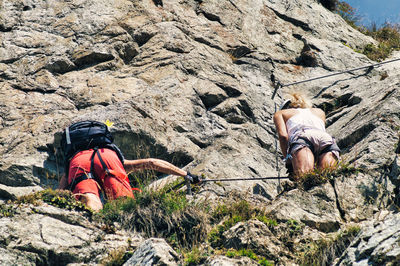 Rear view of people on rock