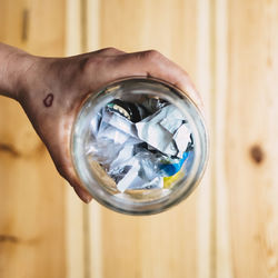 Close-up of person holding glass