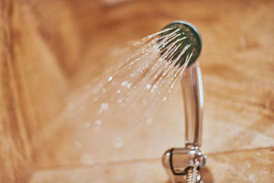 Close-up of water drop on faucet