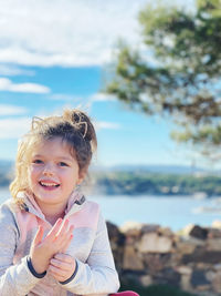 Portrait of smiling boy against sea