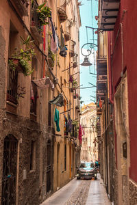 Narrow alley amidst buildings in city