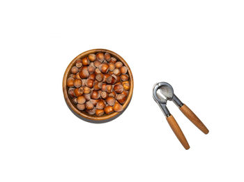 High angle view of coffee beans against white background