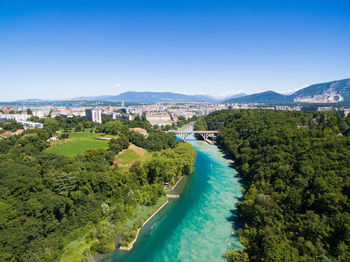 High angle view of cityscape against clear blue sky