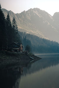 Scenic view of lake and mountains against sky