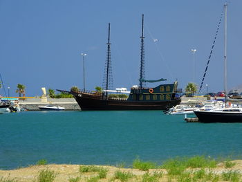 Boats moored at harbor
