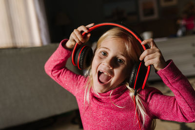 Little girl singing with headphones on