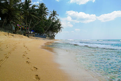 Scenic view of beach against sky