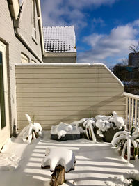 View of white building against cloudy sky
