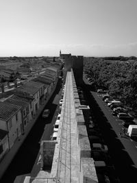 High angle view of fortification wall and historical city against clear sky