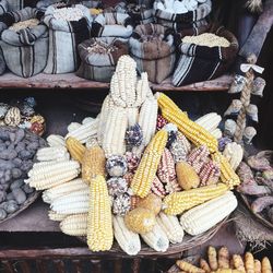 High angle view of stacked corn for sale in market