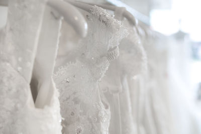 Close-up of wedding dresses in bridal shop
