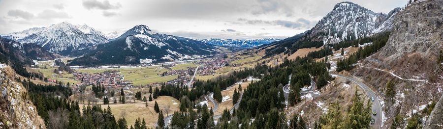 Panoramic shot of snowcapped mountains against sky