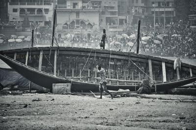 People standing on bridge over river