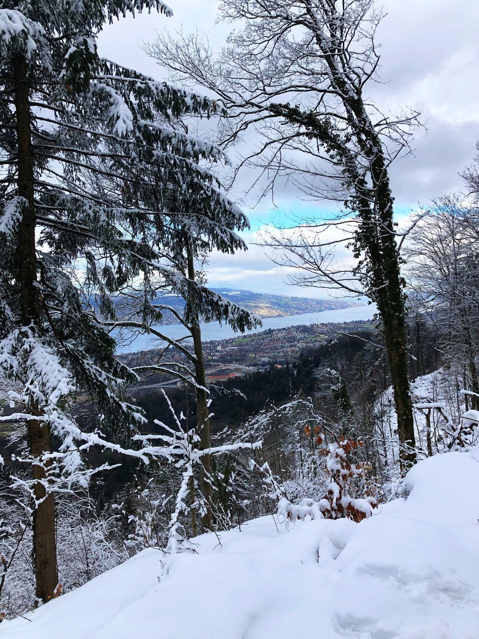 SNOW COVERED LAND AGAINST SKY