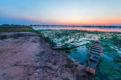 Scenic view of field against sky during sunset