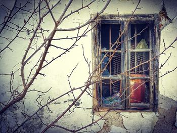 Abandoned building seen through window