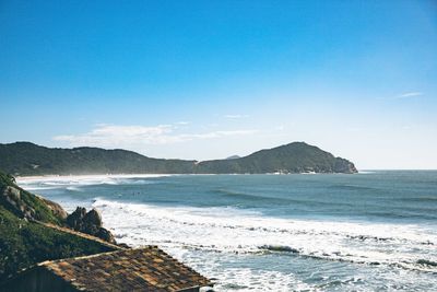 Scenic view of sea against clear blue sky