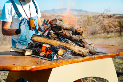 Man preparing food on barbecue grill