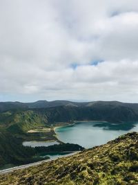 Scenic view of lake and mountains against sky