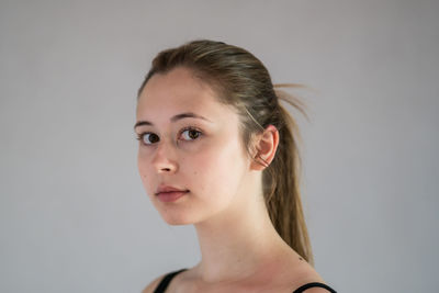 Portrait of a beautiful young woman over white background