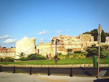 Buildings against blue sky and clouds