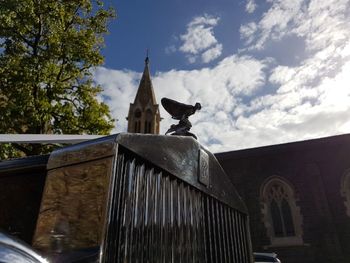 Low angle view of a statue against building