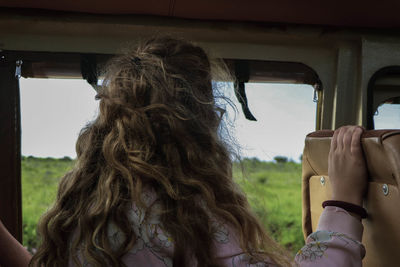 Rear view of woman in bus