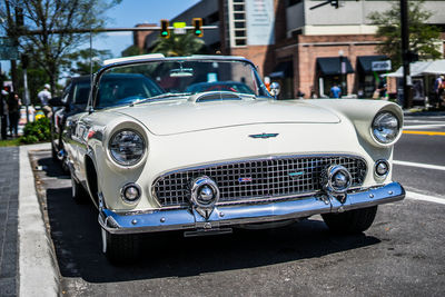 Vintage car parked on road in city