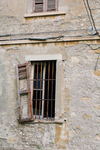 Low angle view of window on old building