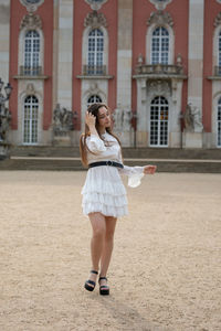 Full length of woman standing in city