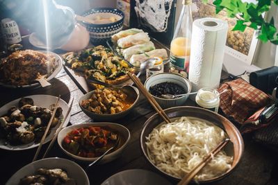 High angle view of various asian food in bowls on table