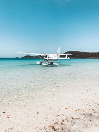 Scenic view of sea against clear blue sky