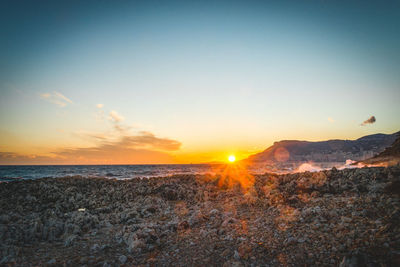 Scenic view of sea against sky during sunset