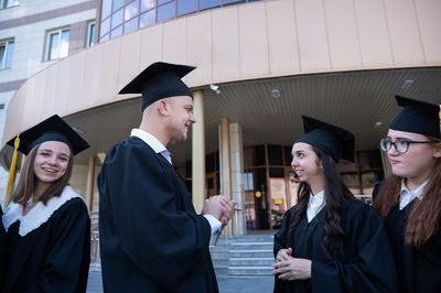 Portrait of woman wearing graduation