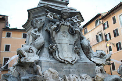 Statue in front of historic building