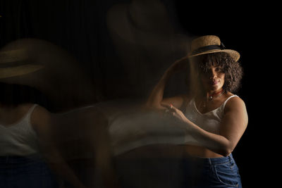 Time-lapse view of woman moving a hat. long exposure, motion blur. 