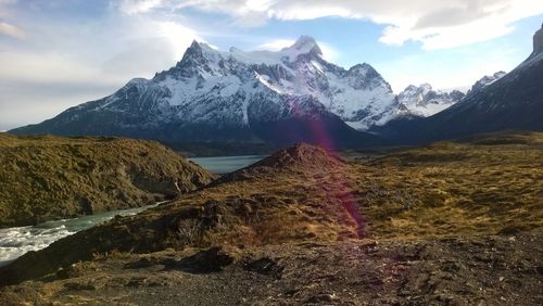 Scenic view of snowcapped mountains against sky