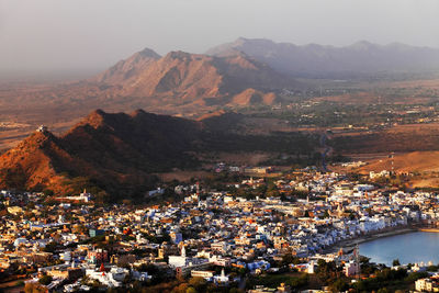 High angle view of residential district and mountains