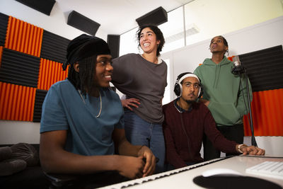 Portrait of musicians working in recording studio