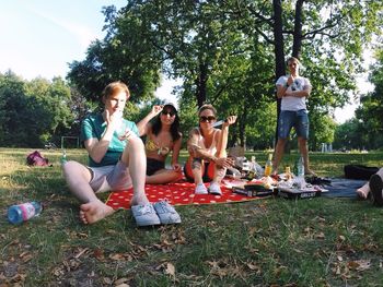 People relaxing in park