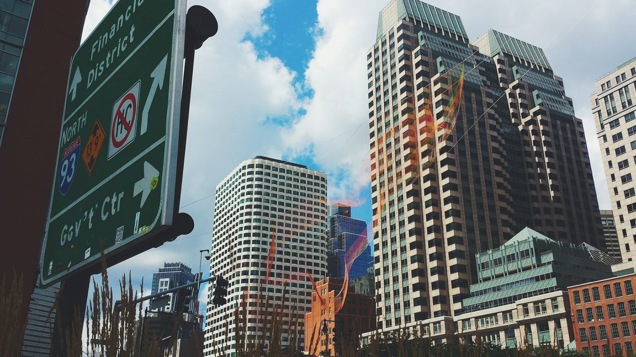 LOW ANGLE VIEW OF MODERN BUILDINGS AGAINST SKY