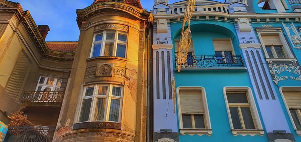 Low angle view of residential building against blue sky