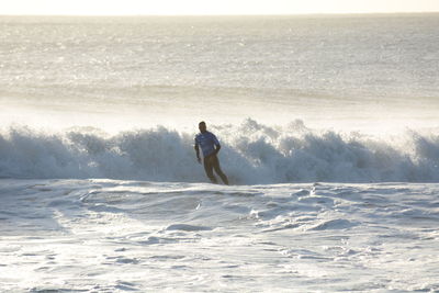 Man surfing in sea