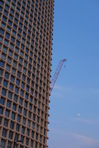 Low angle view of building against blue sky