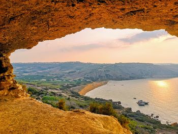 Scenic view of landscape against sky during sunset