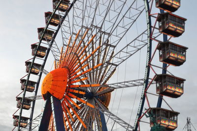 Low angle view of ferris wheel against clear sky