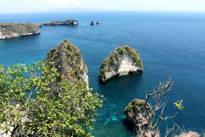 High angle view of rocks in sea