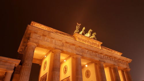 Low angle view of historical building at night