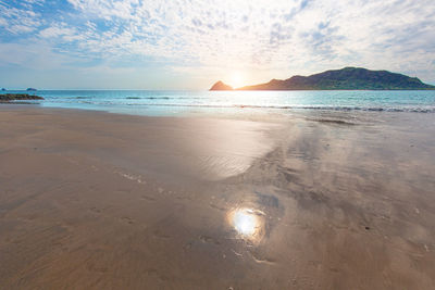 Scenic view of beach against sky during sunset