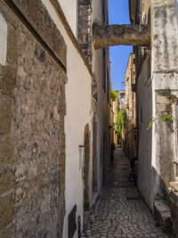 Narrow alley amidst buildings in city